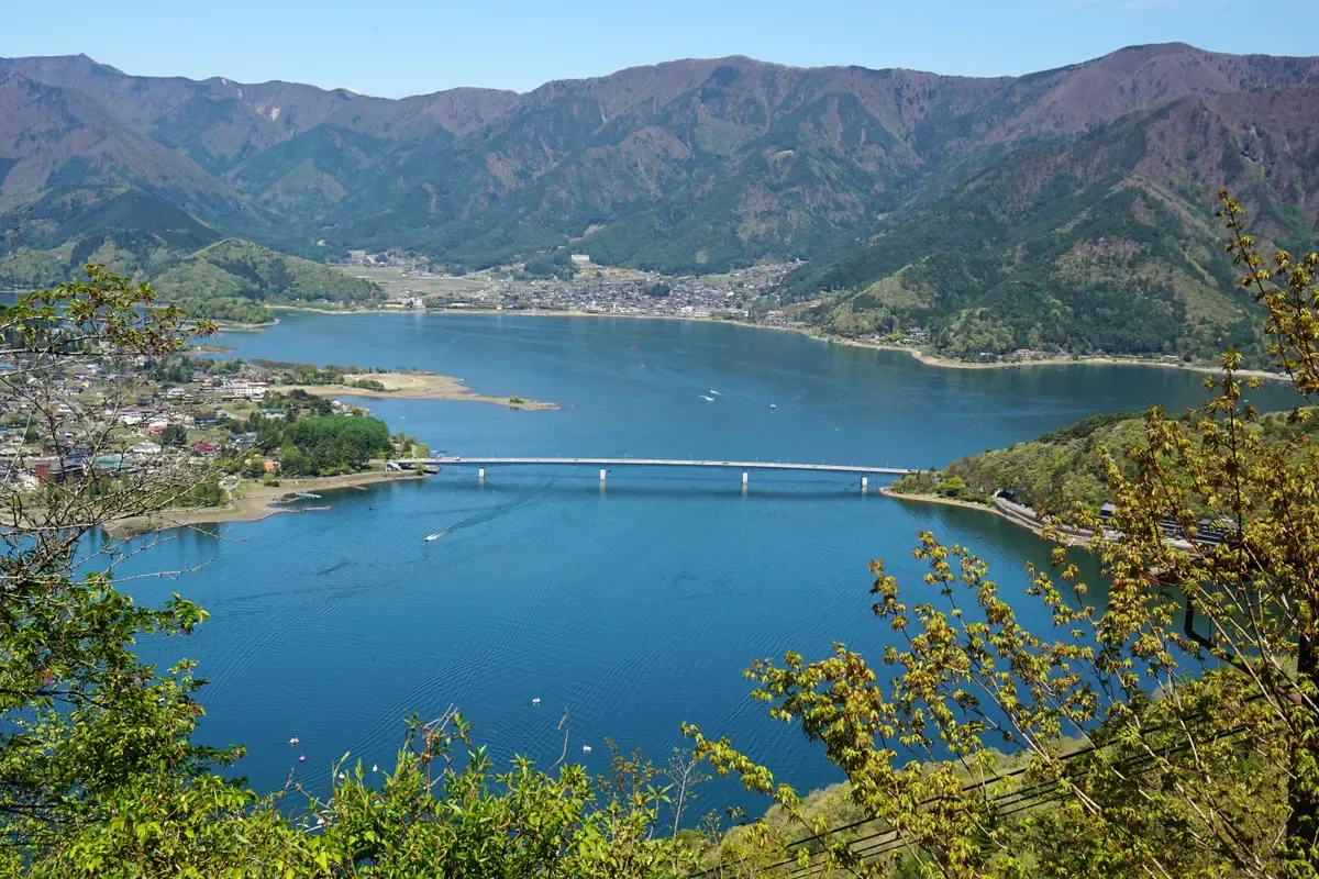 Lake Kawaguchi and its bridge seen from above on a day trip from Tokyo to the Fuji Five Lakes