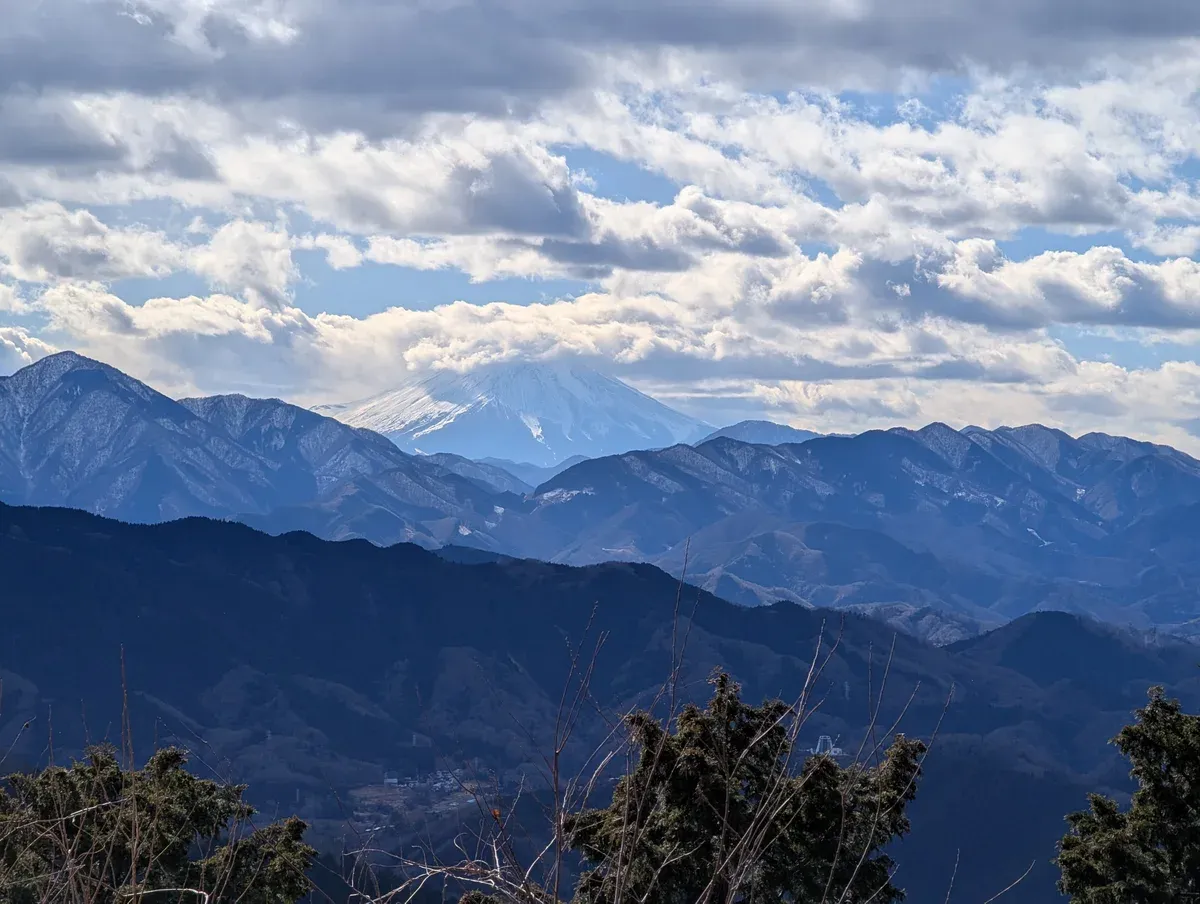 Snowy Mt Fuji seen from the summit of Mount Takao on a day trip from Tokyo by Keio train